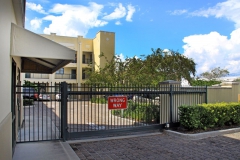 Closed gate showing entrance to gated parking area